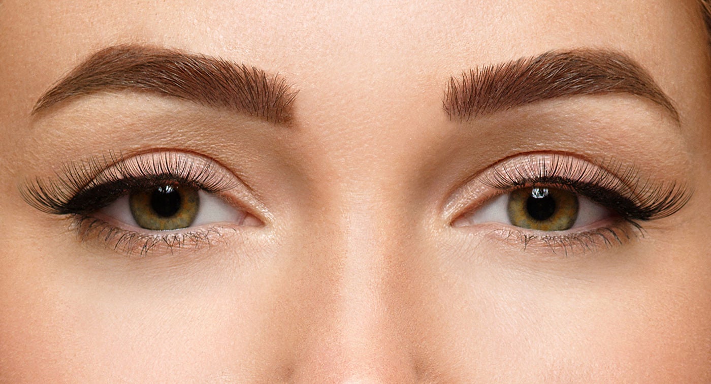 Close-up of woman's eyes and microbladed brows